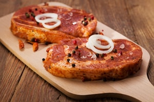 Marinated Raw Pork Ready for Roasting on a Wooden Table